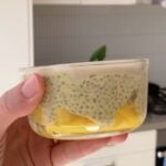 Mango chia pudding with a layer of crack-top white chocolate.