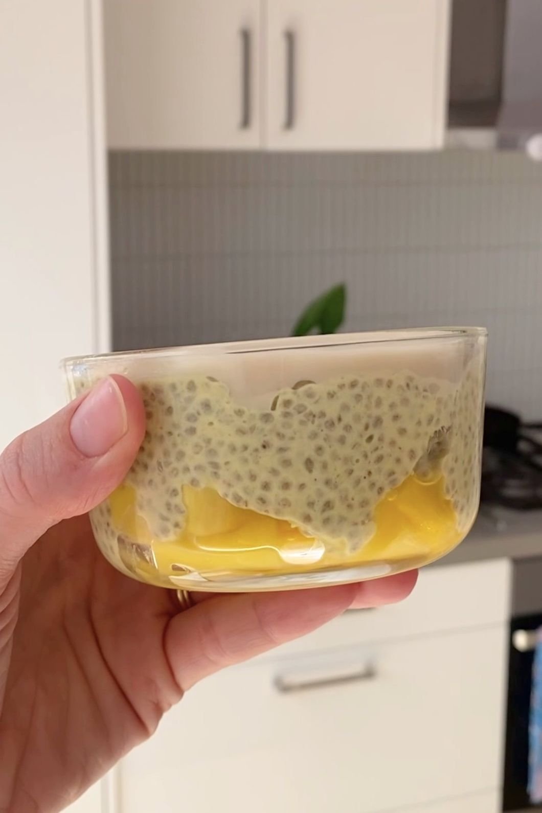 Mango chia pudding with a layer of crack-top white chocolate.