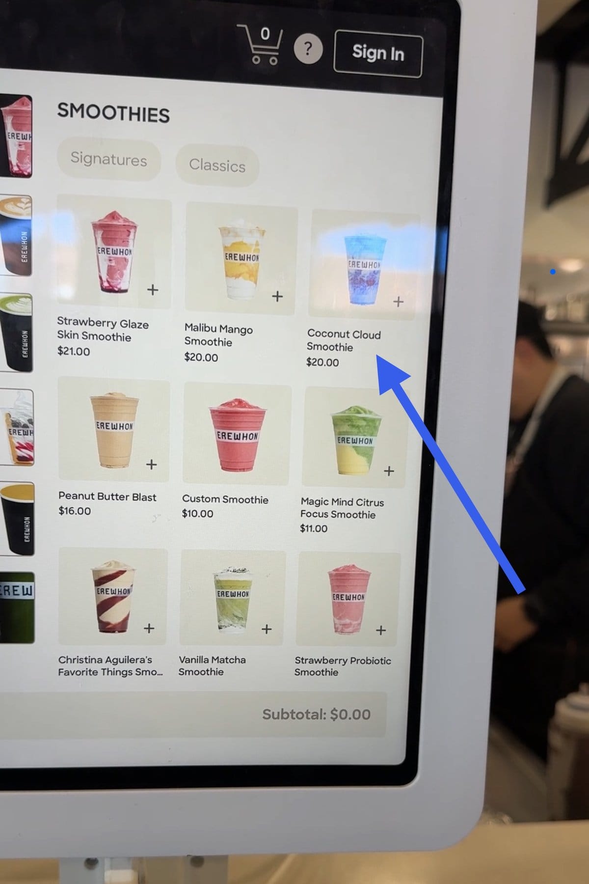 Erewhon smoothie menu with an arrow pointing to the blue Coconut Cloud Smoothie.
