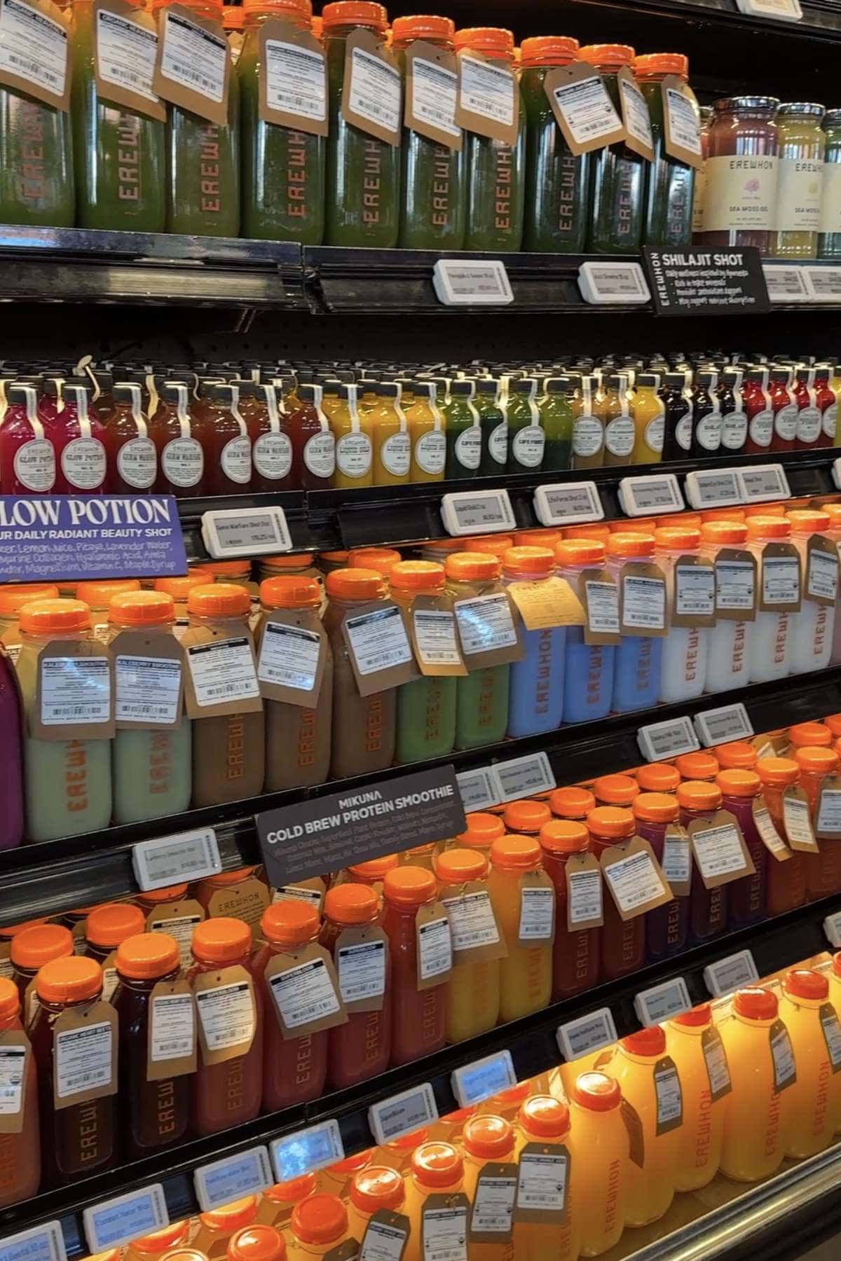 Rows of bottled juices, wellness shots and smoothies in the Erewhon fridge.