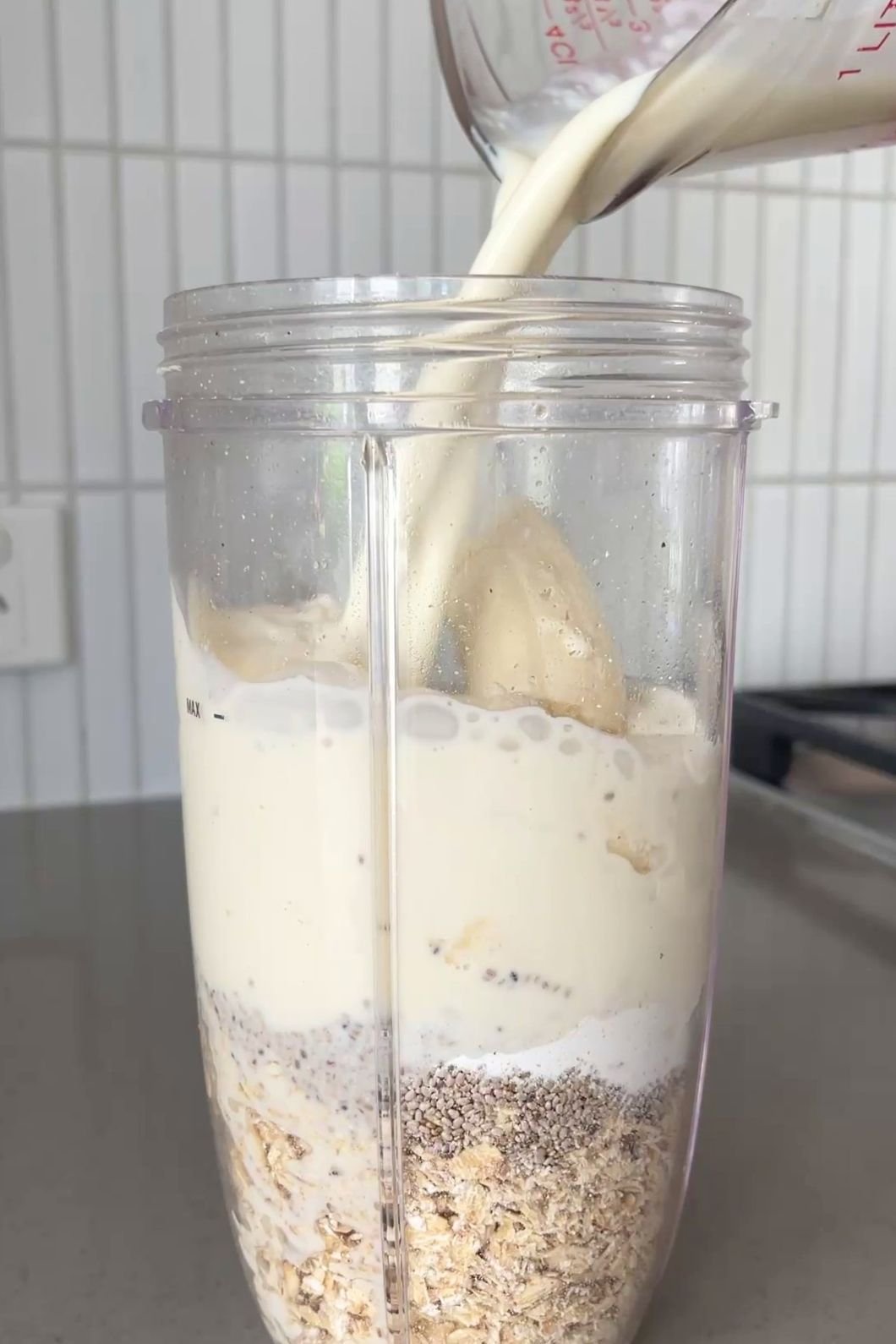 Milk poured over oats, chia, banana.