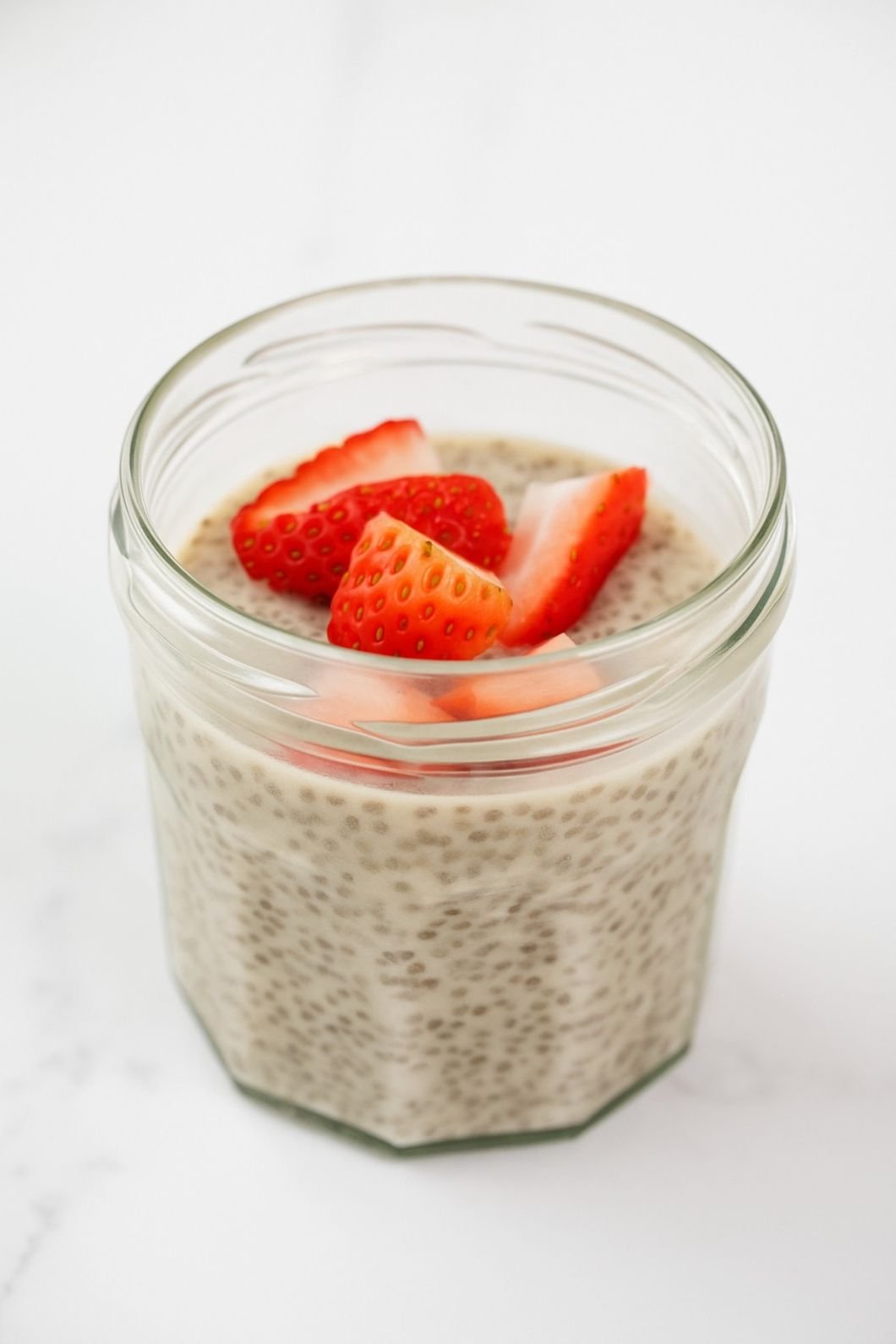 Vanilla chia pudding with fresh strawberry slices.