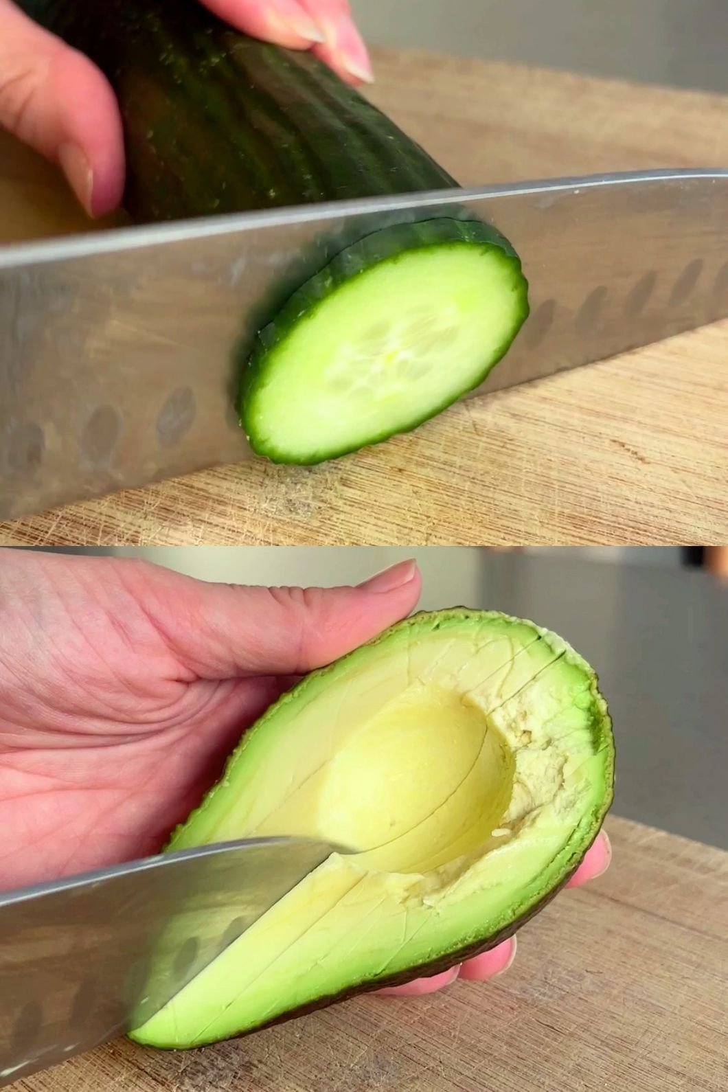 Hand slicing cucumber on a board and scooping avocado flesh with a knife.
