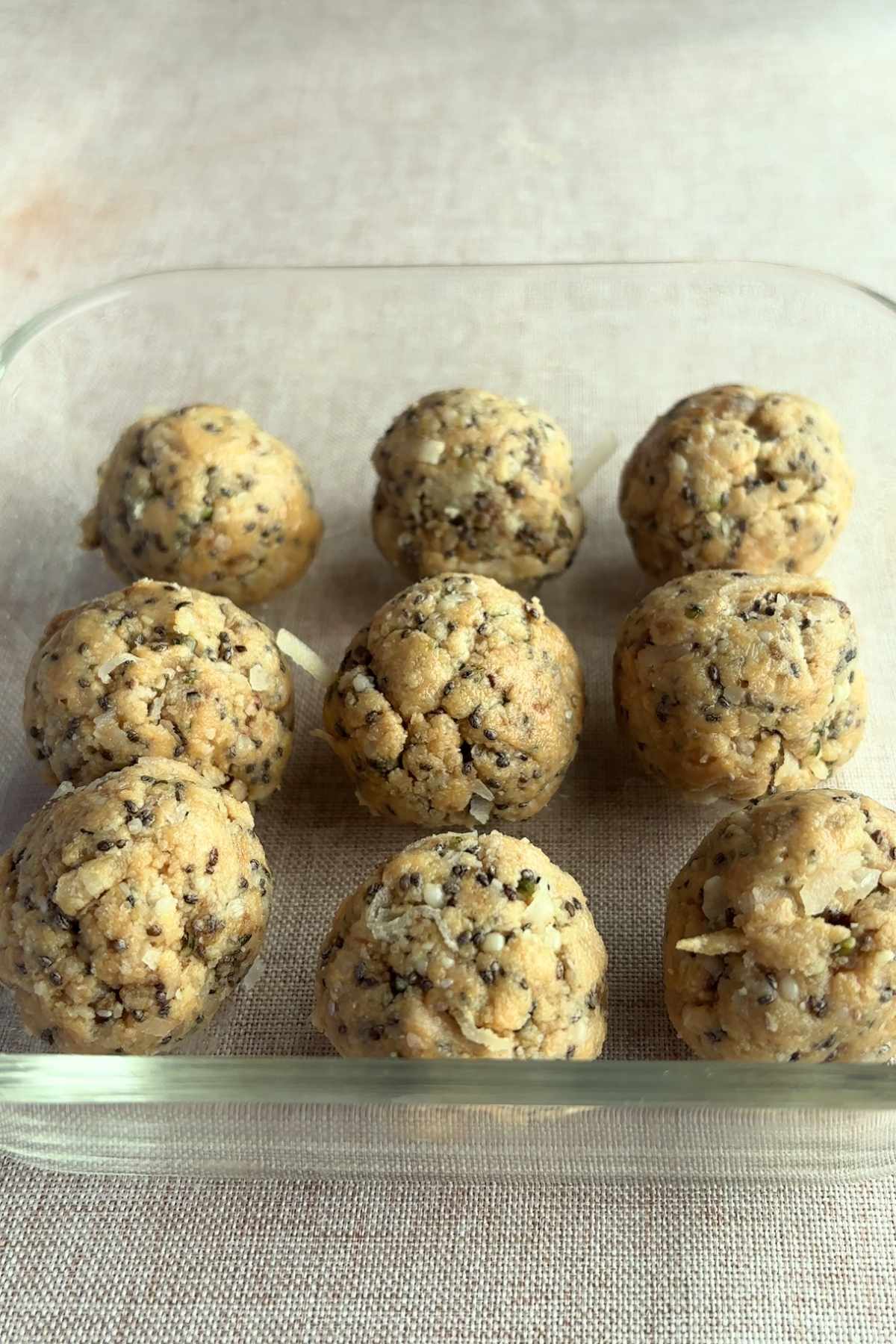 Formed protein balls arranged in a glass container.
