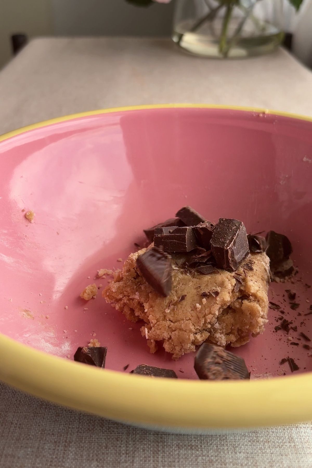 Cookie dough with chopped chocolate chunks mixed through.
