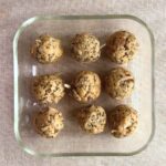 Top view of protein balls neatly arranged in a glass container.