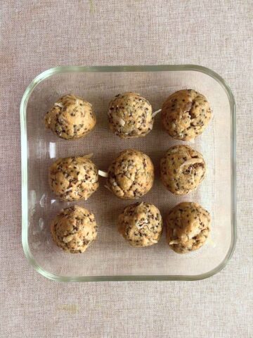 Top view of protein balls neatly arranged in a glass container.