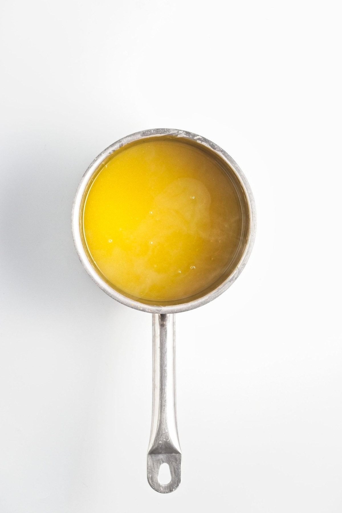 Saucepan with thickened lemon curd.