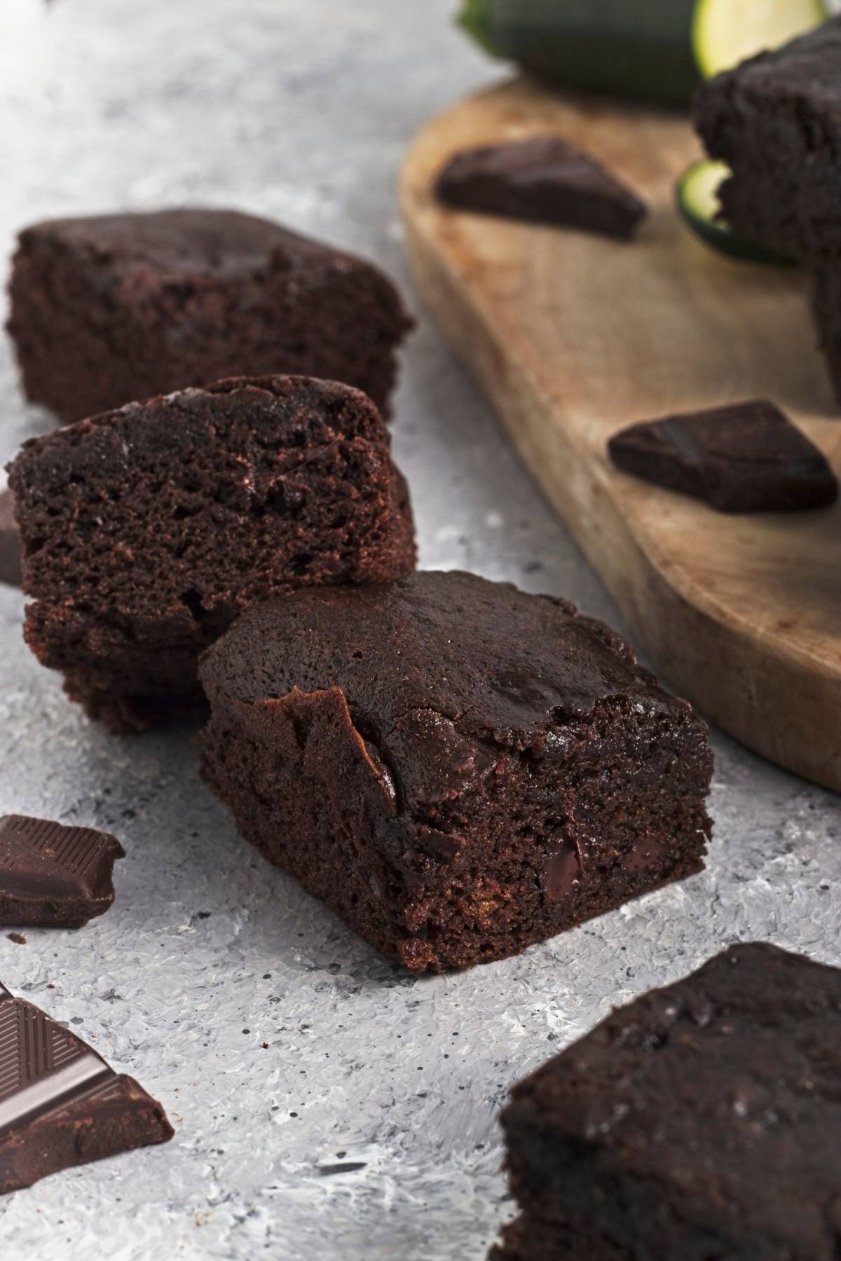Close-up of fudgy brownie squares with melted chocolate pieces.