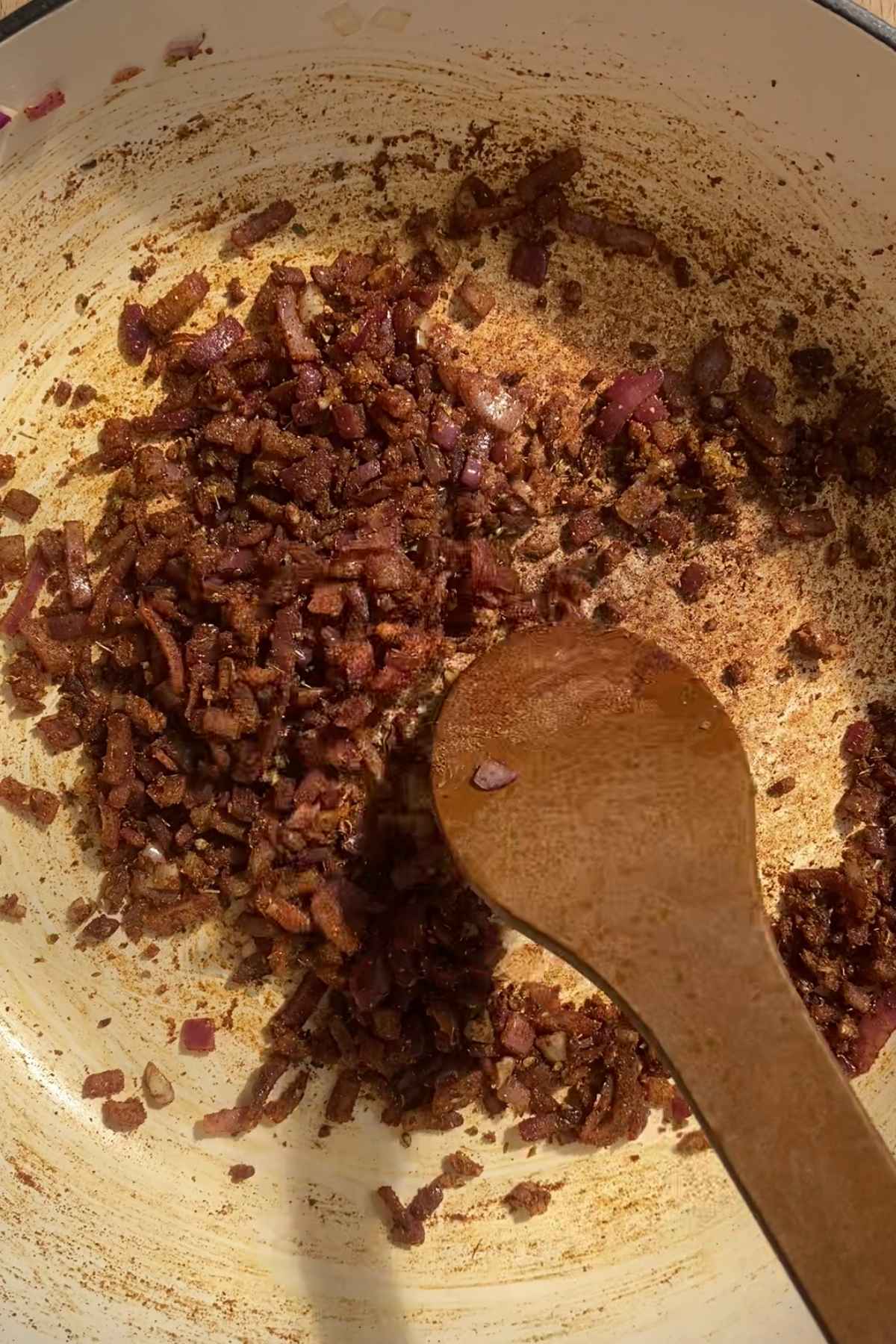 Chopped onion cooked with spices in a pan.