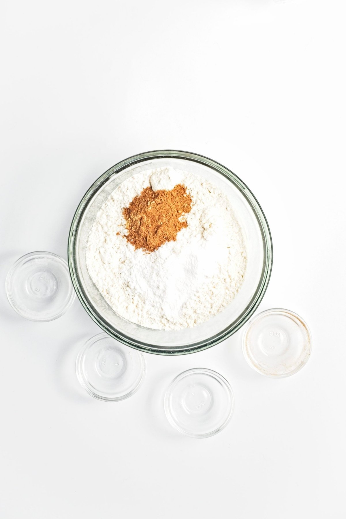 Dry ingredients with spices in a glass bowl.