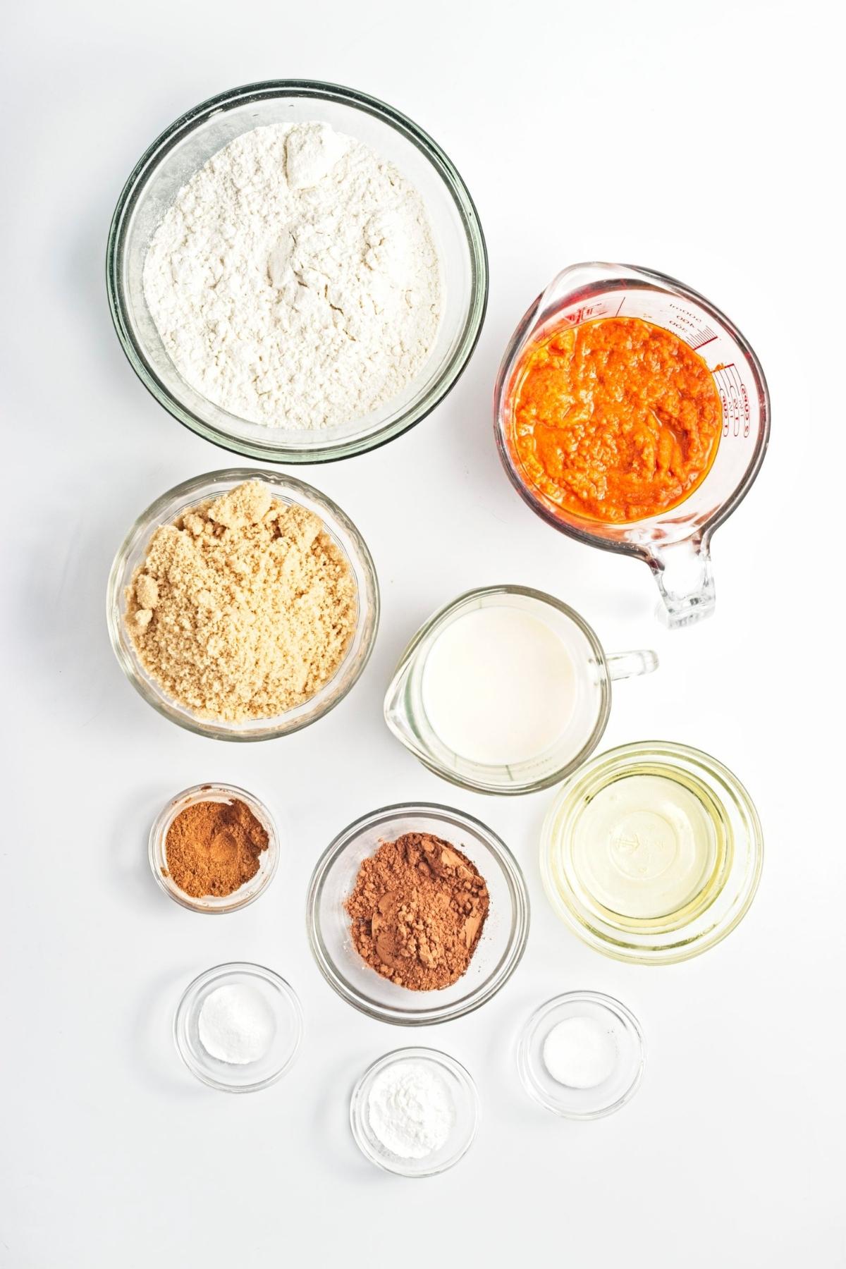 Bowl of ingredients measured out on a white surface.