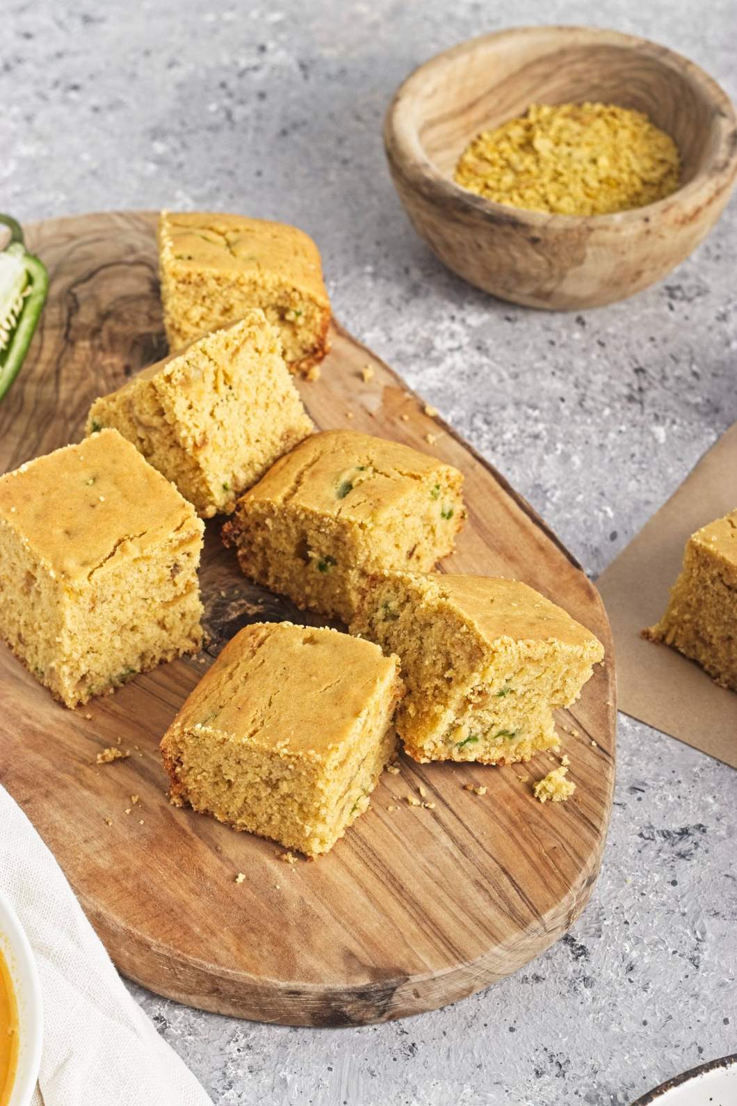 Stacked pieces of golden cornbread showing a soft, crumbly texture.