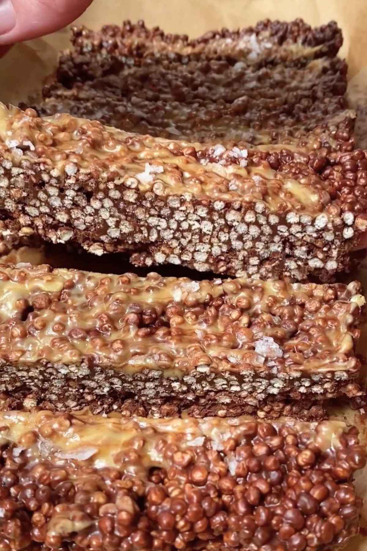 Sliced chocolate quinoa bars showing layered texture with peanut butter topping.