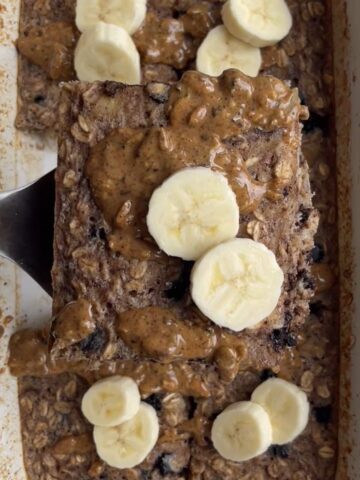 Close-up of banana chocolate chip baked oats with visible oats and melted chocolate.