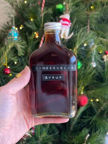 Glass bottle filled with dark gingerbread syrup.