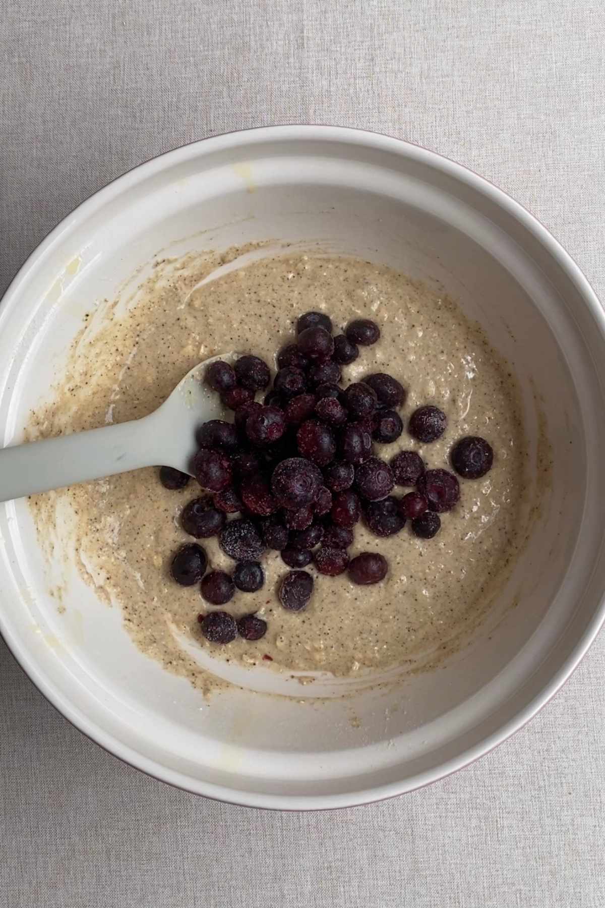 Fresh blueberries added to blueberry muffin batter before folding through.