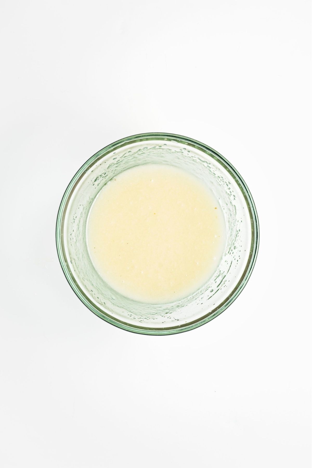 Wet ingredients whisked together in a glass bowl until smooth.