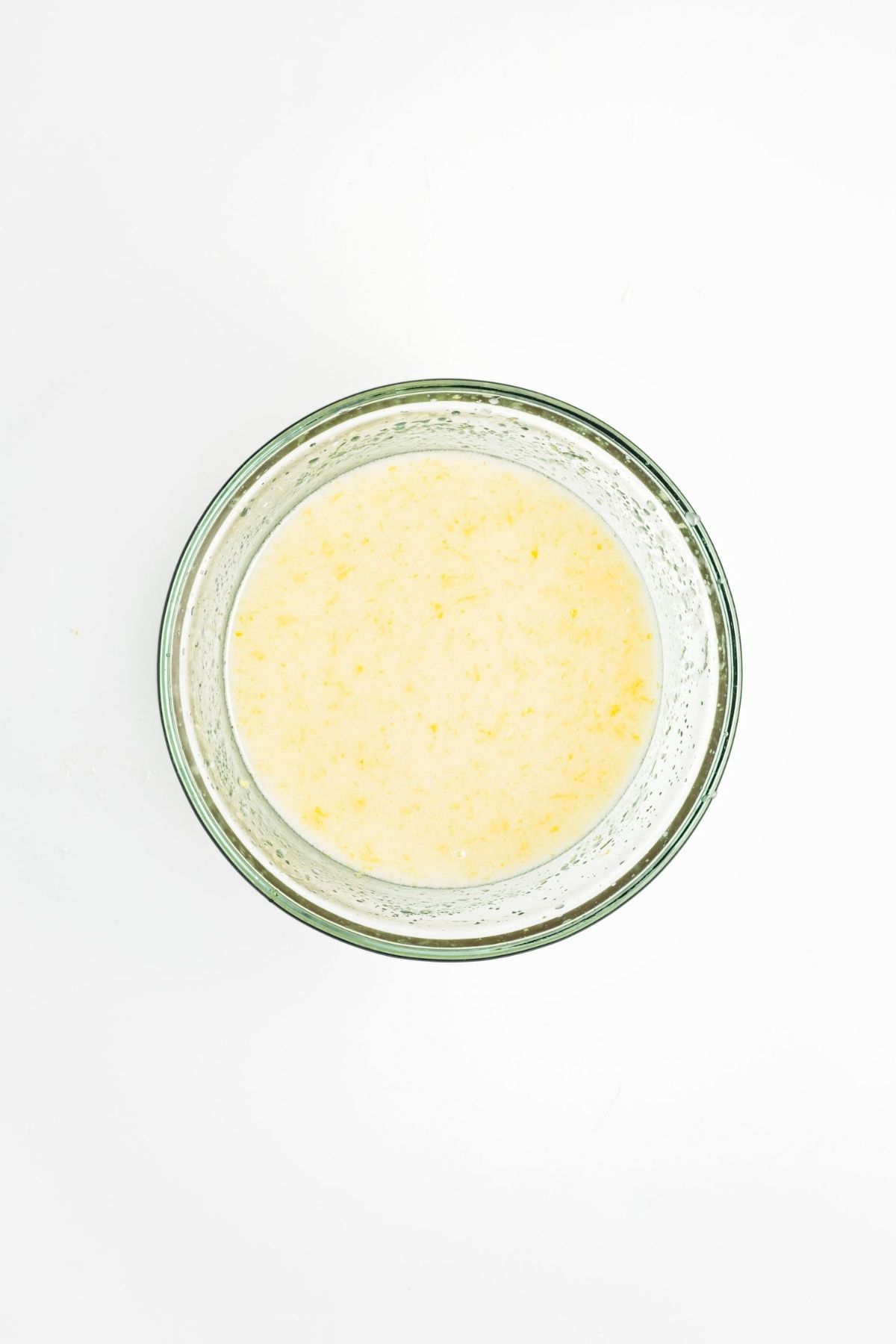 Dry ingredients combined in a glass bowl before mixing.