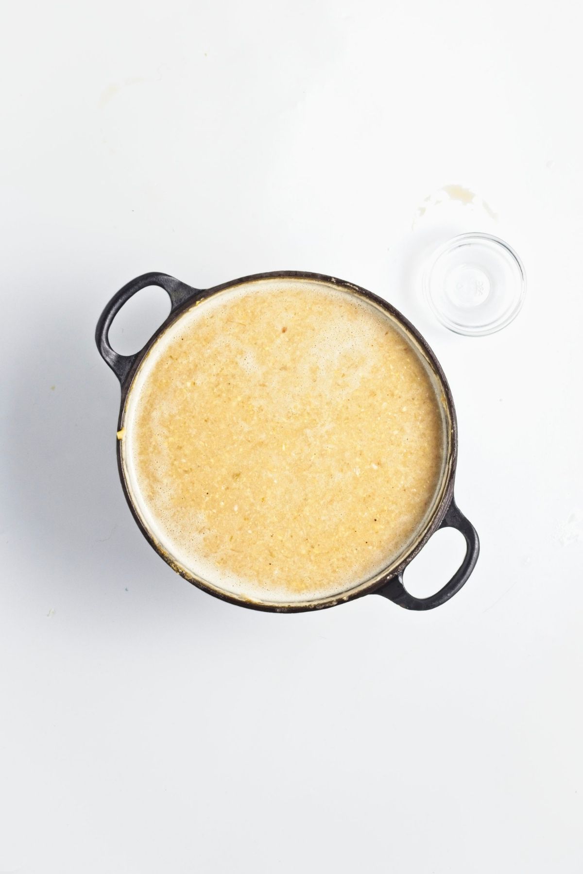 Blended corn soup in a pot, smooth and creamy in texture.