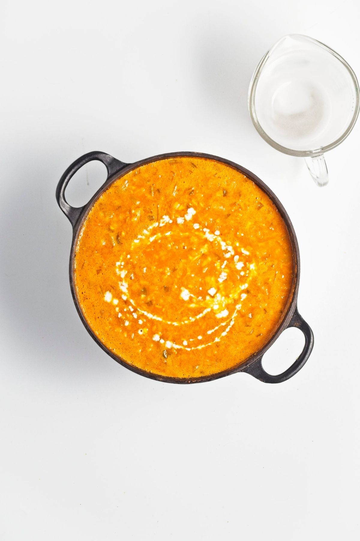 Finished lentil soup stirred in the pot with a creamy consistency.
