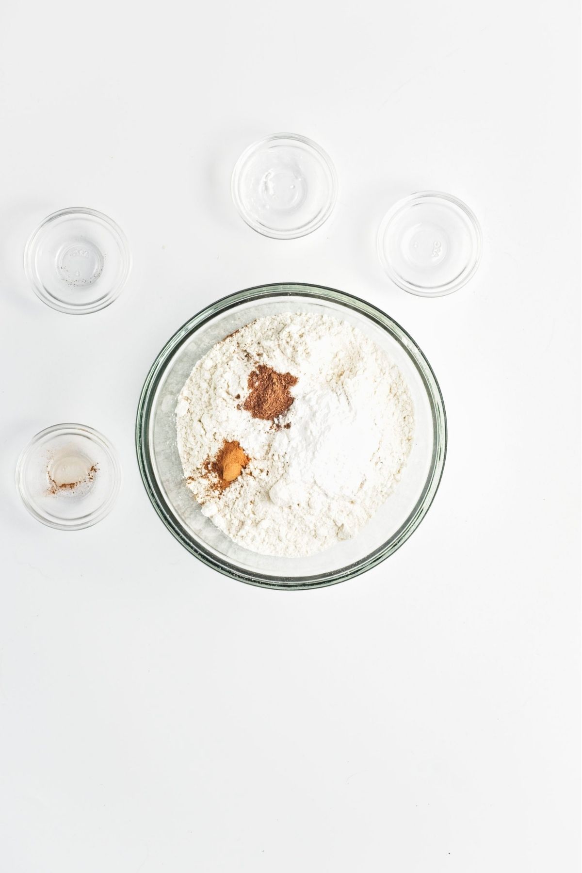 Dry ingredients mixed together in a bowl with flour baking powder and spices