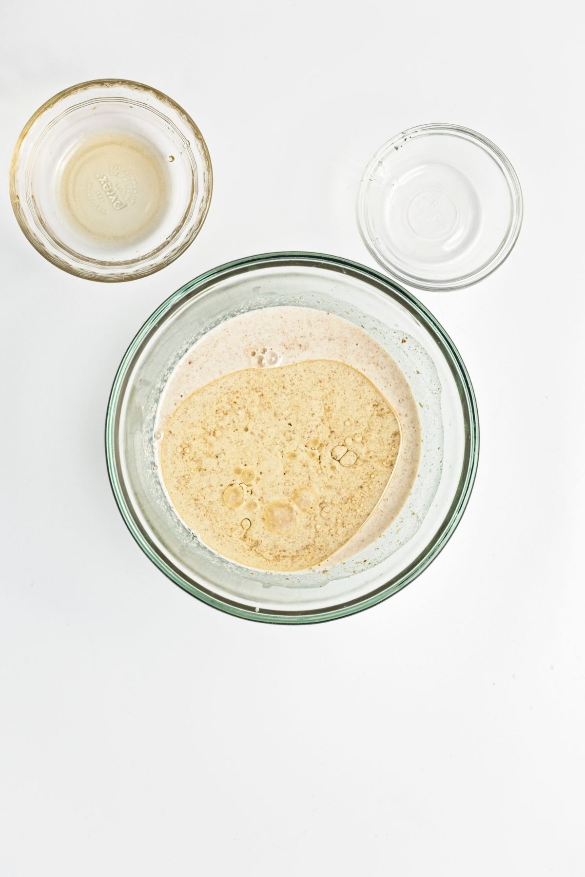 Wet ingredients whisked together in a bowl until smooth for vegan carrot cake muffins