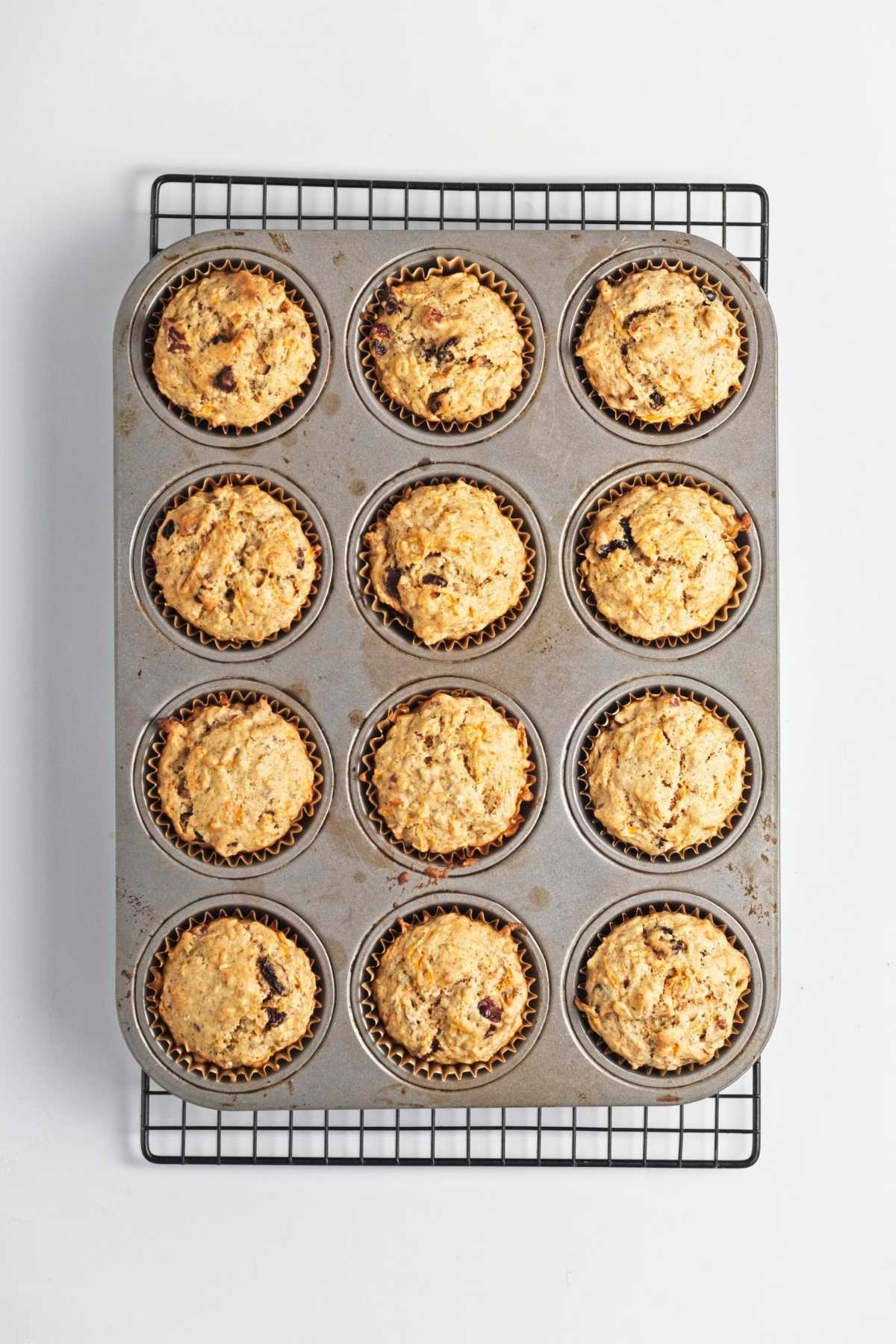 Muffin batter scooped into lined muffin tin before baking