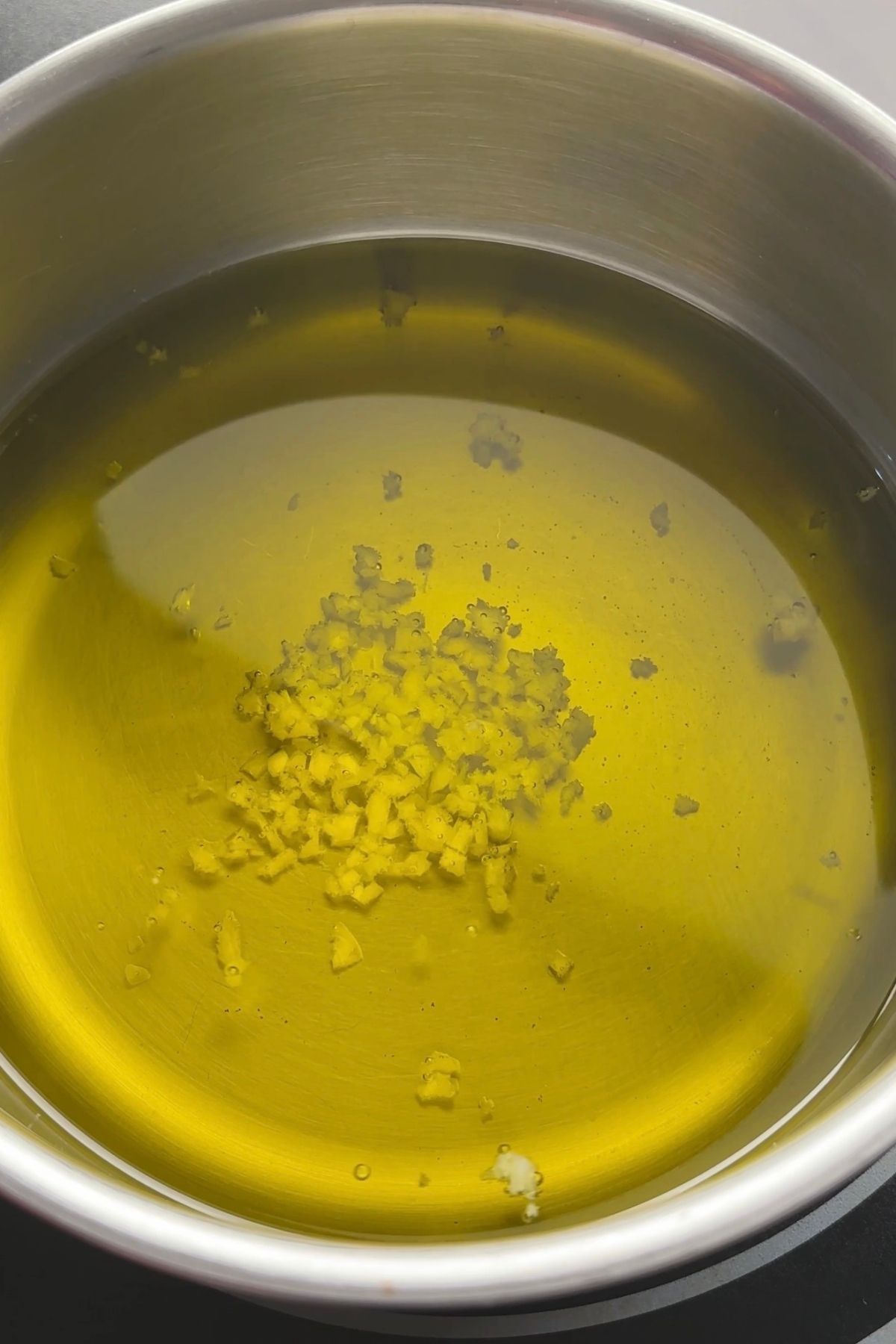 Whisking the dressing as olive oil emulsifies into the lemon Dijon mixture.