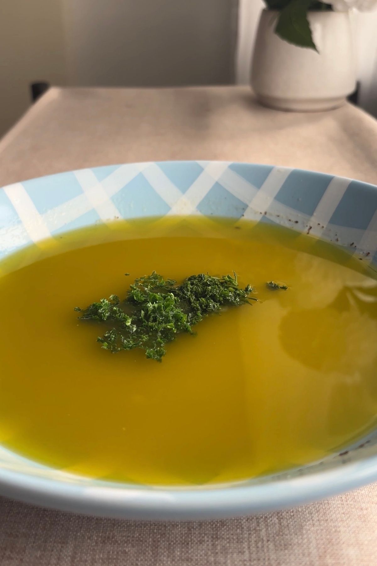 Finished lemon Dijon dressing with chopped herbs stirred through.