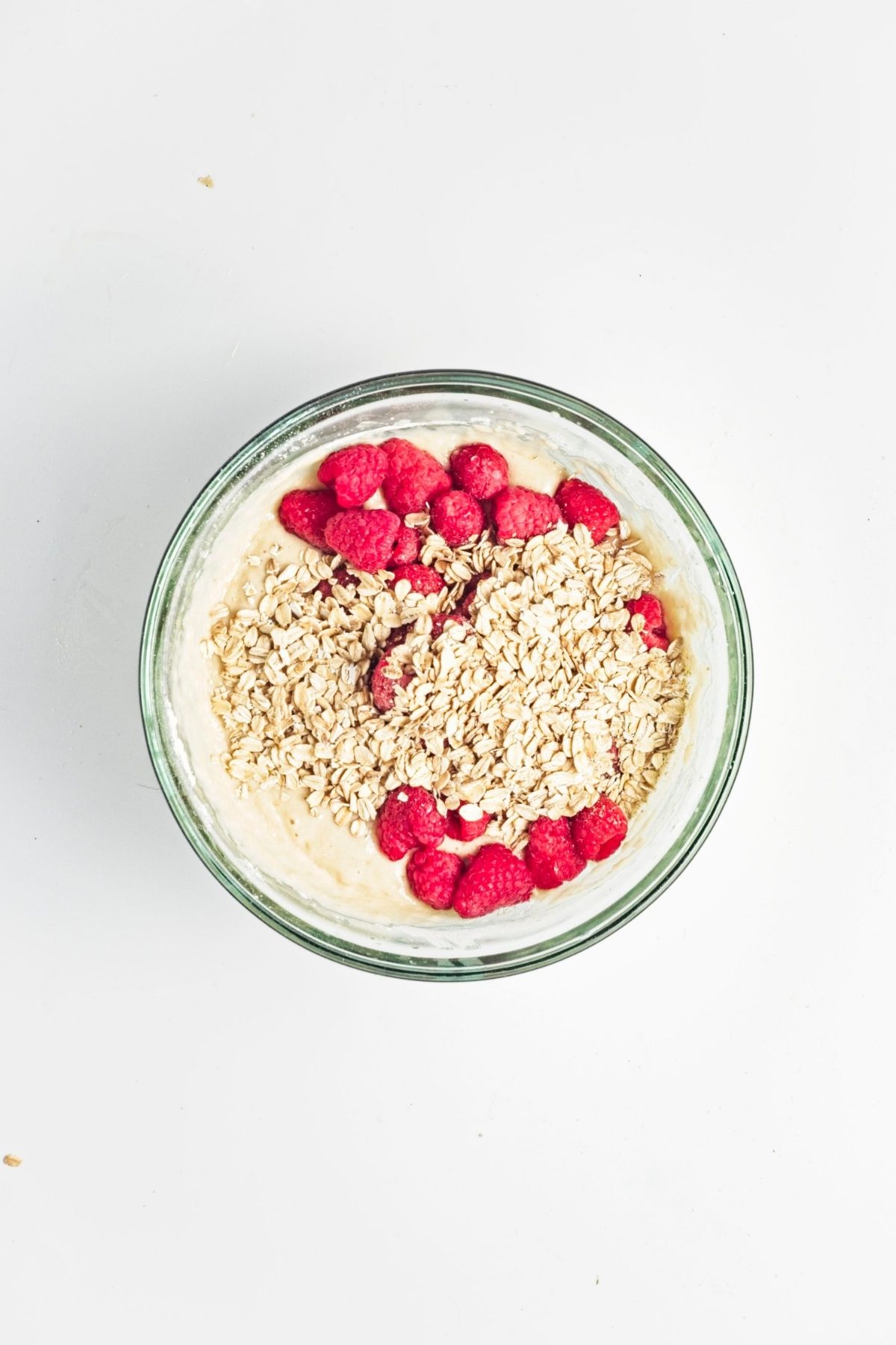 Fresh raspberries and rolled oats added to the muffin batter before folding through.
