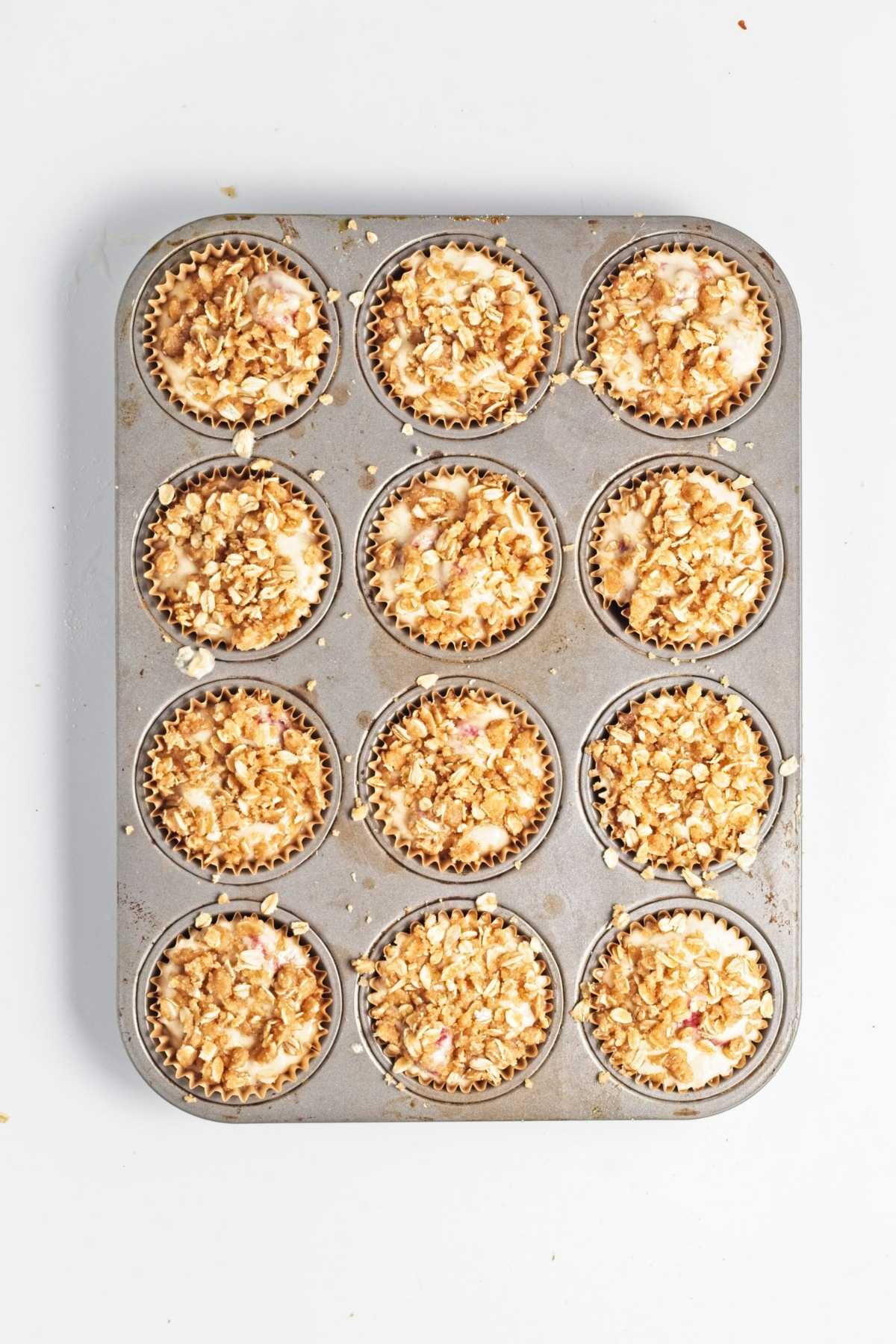Freshly baked raspberry oat muffins topped with oat streusel