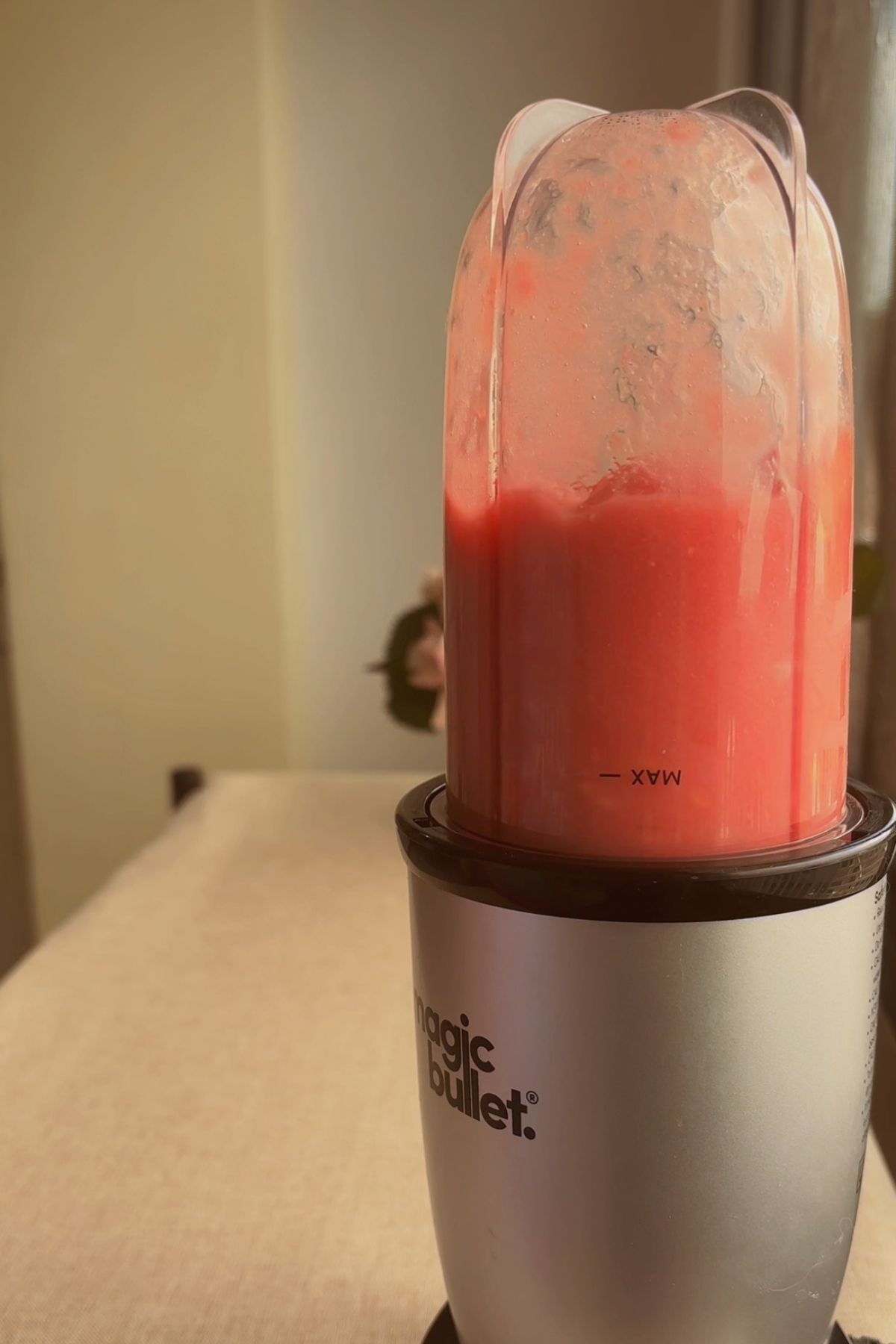 Guava mixture blended in a Magic Bullet blender cup.