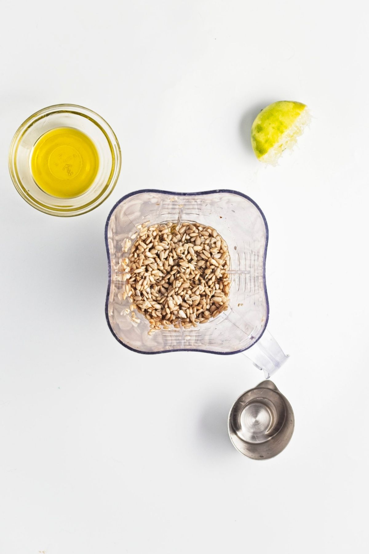 Sunflower seeds in blender with olive oil and lime for chipotle dressing