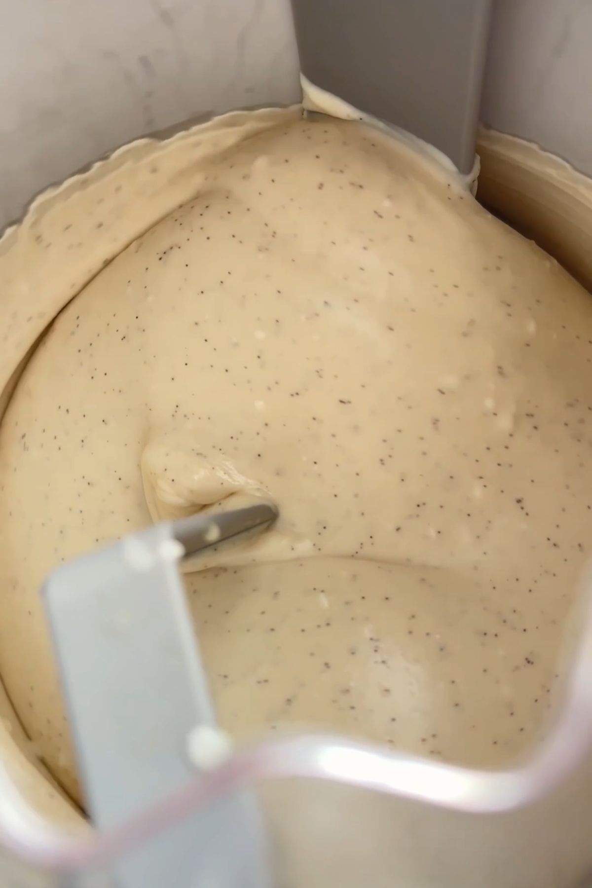 Coconut vanilla ice cream churning in ice cream maker