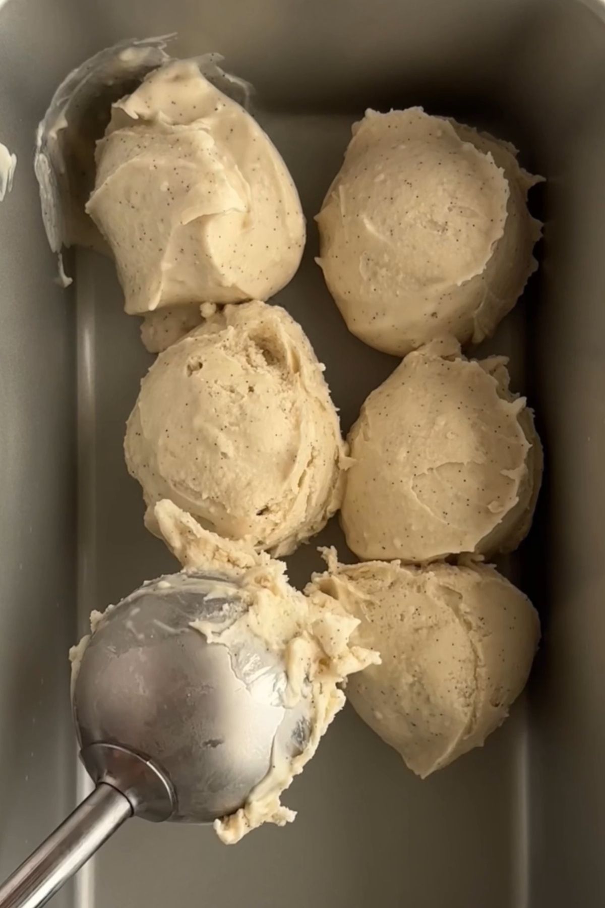 Thick chilled coconut cream scooped into a tray