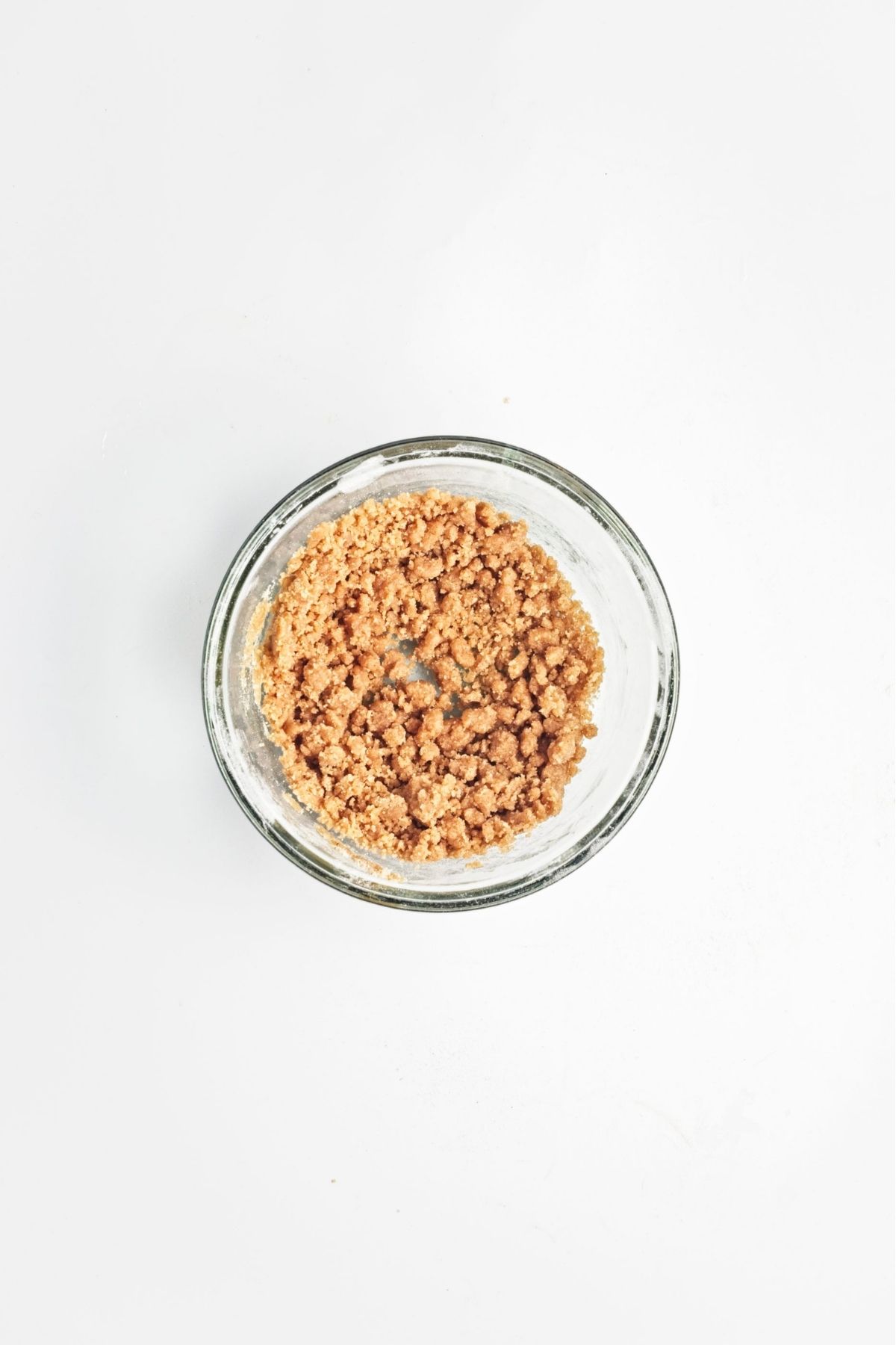 Crumb topping mixture in a glass bowl.