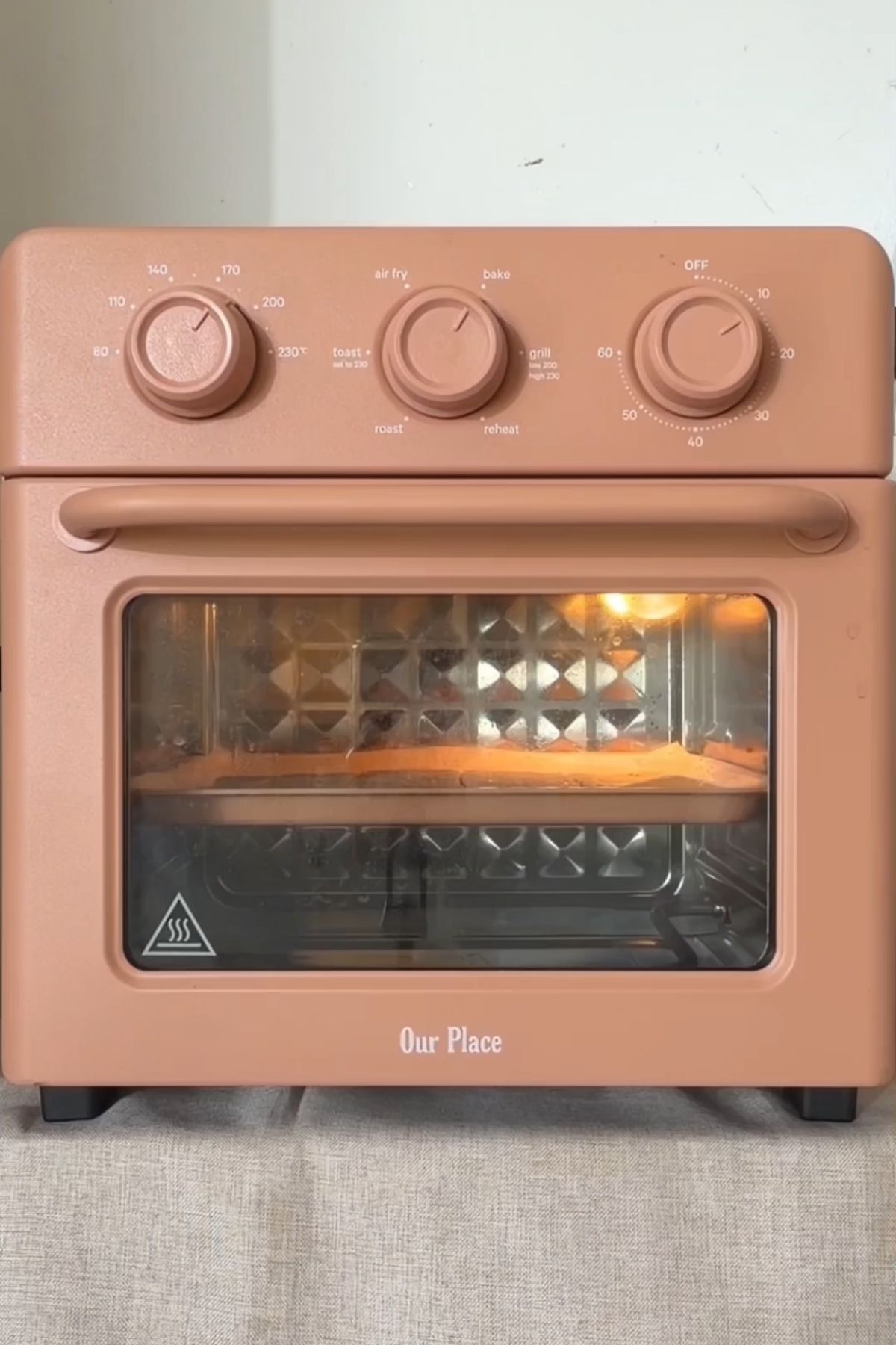 Tray of crackers baking in a countertop oven.