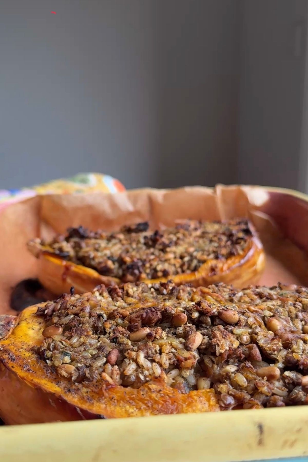 Baked stuffed butternut squash halves before adding the tahini sauce.