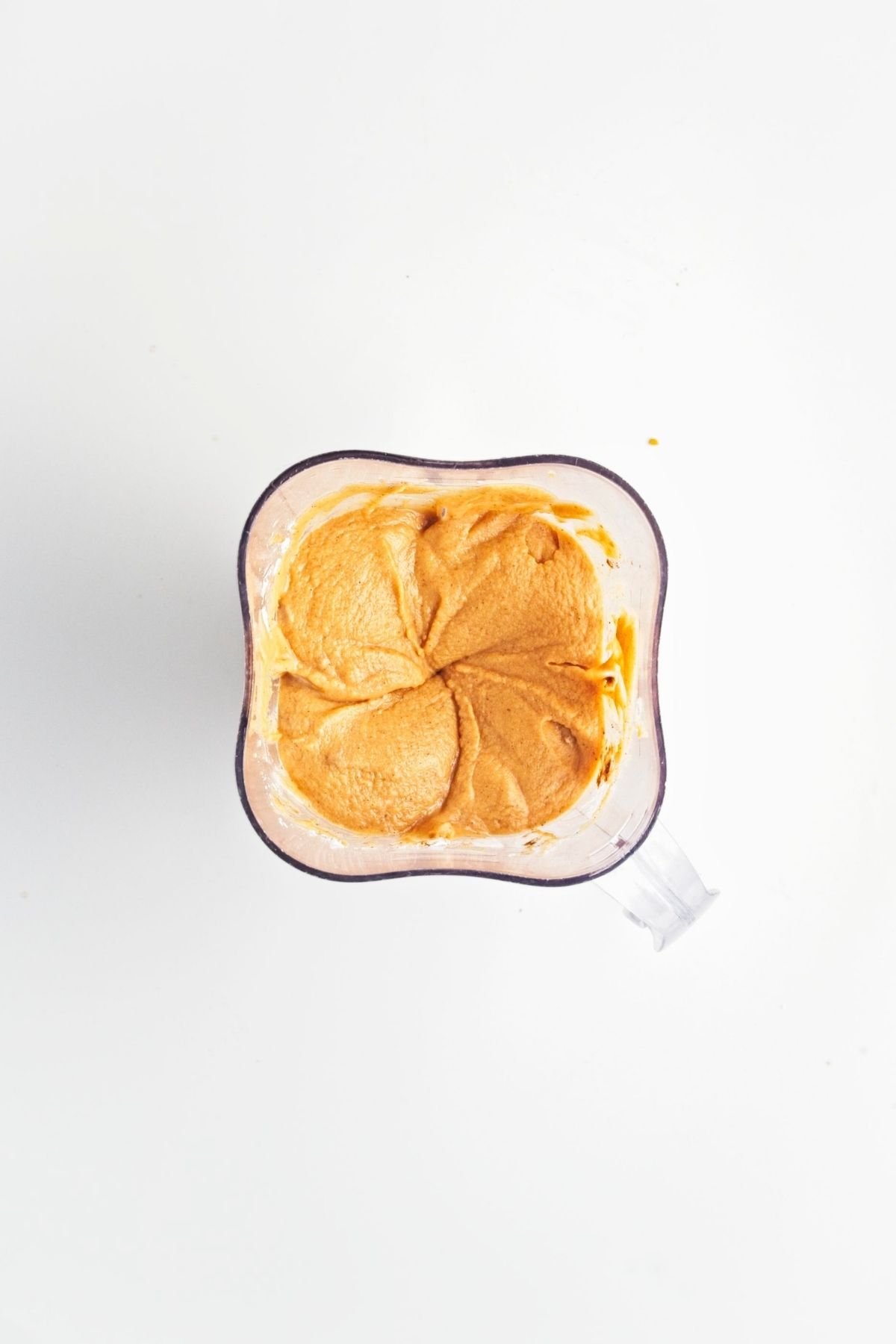 Smooth sweet potato filling blended in a blender jug.