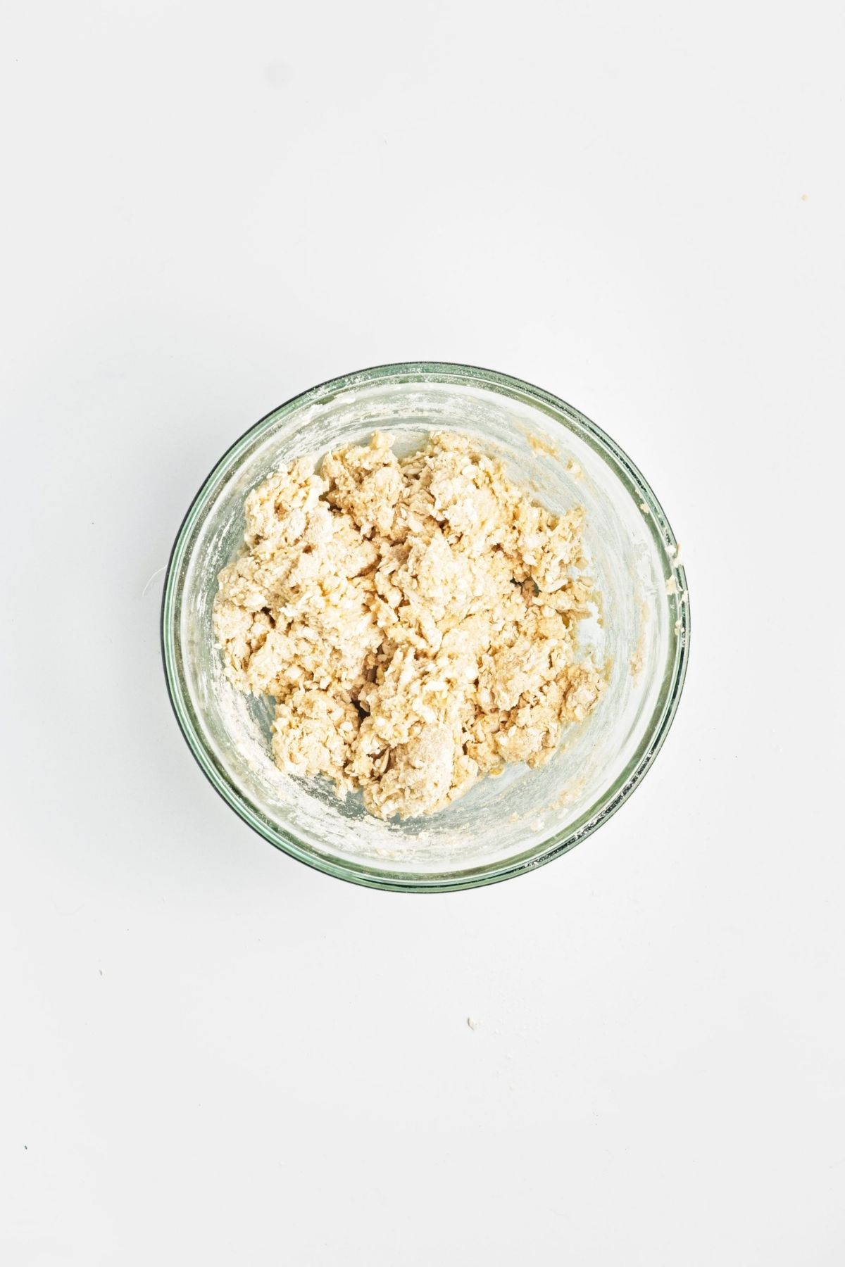 Dry ingredients mixed in a glass bowl.