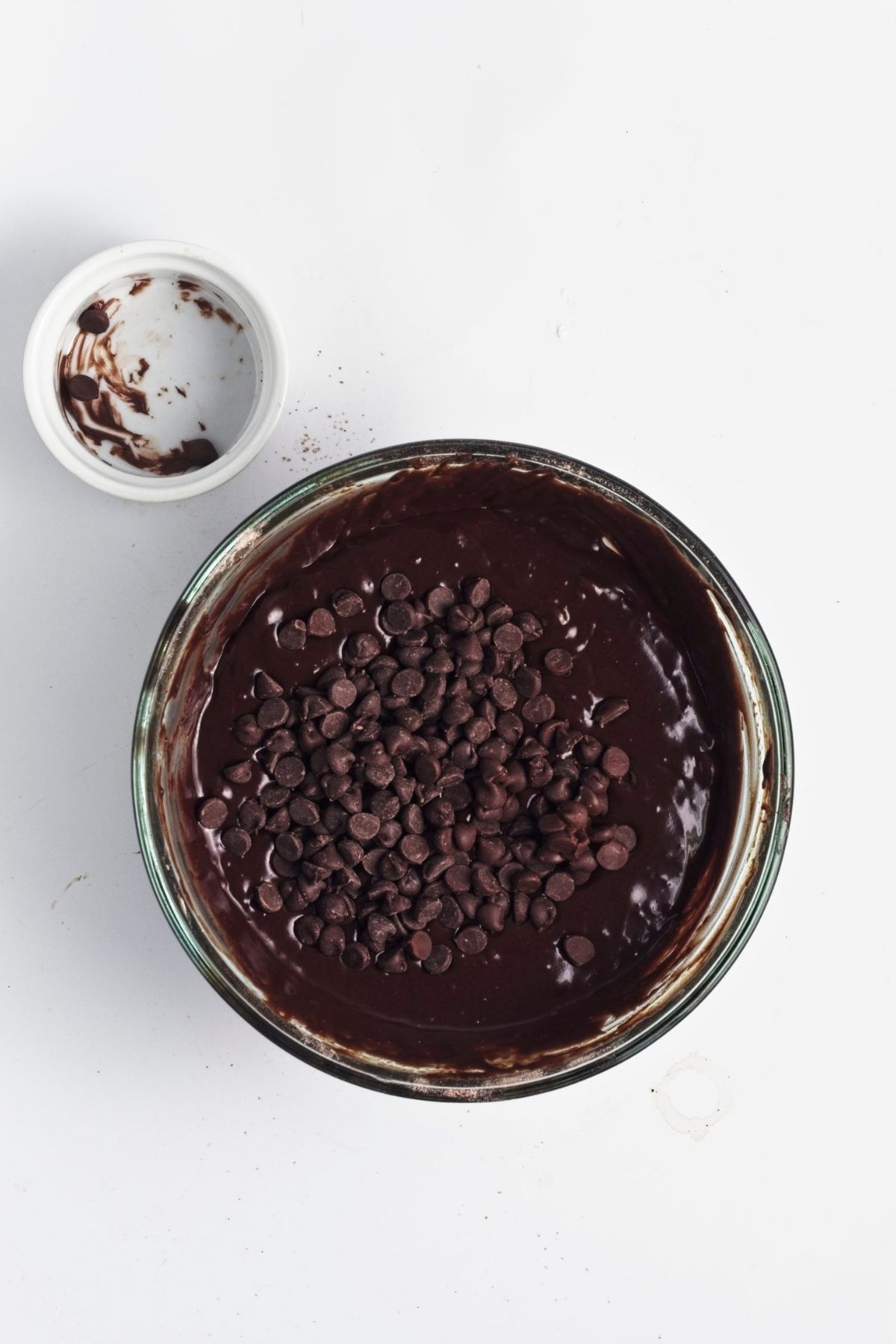 Chocolate chips added to glossy chocolate batter.
