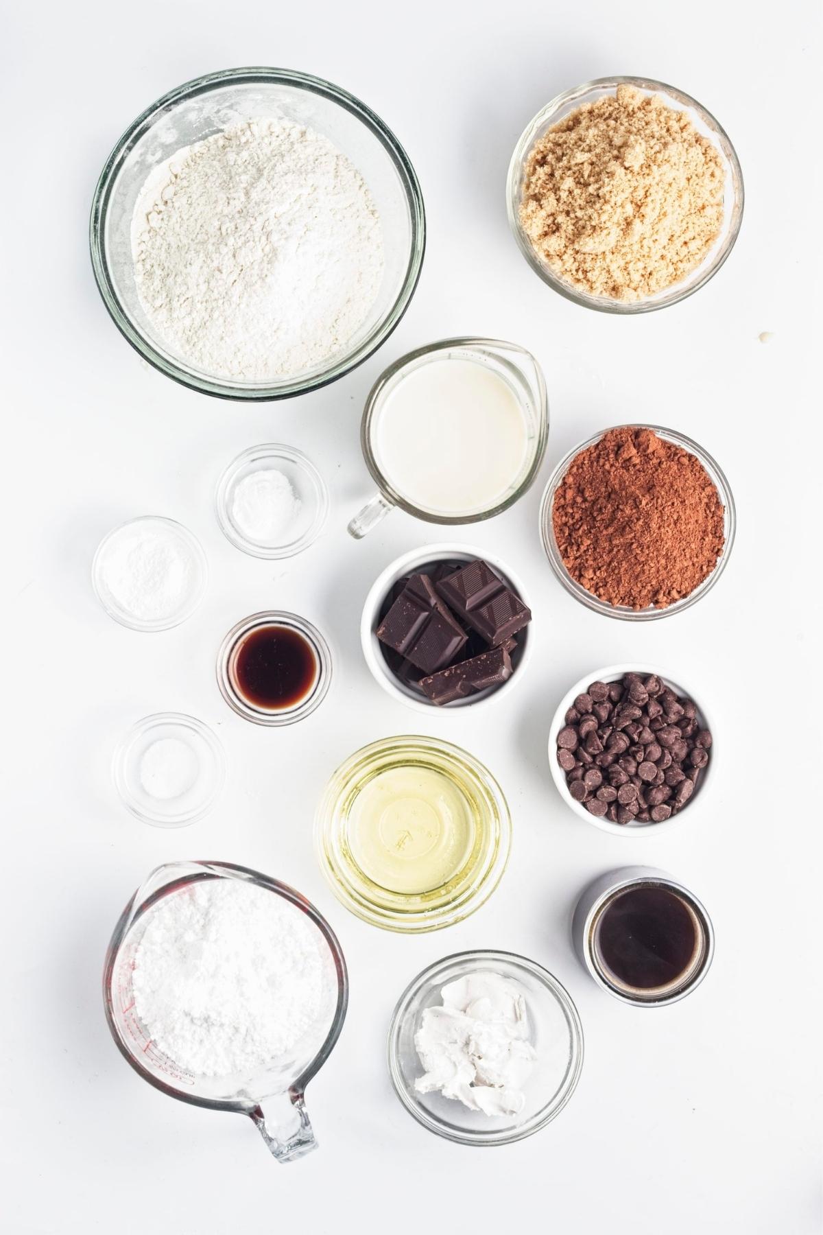 Measured baking ingredients arranged in bowls and cups.