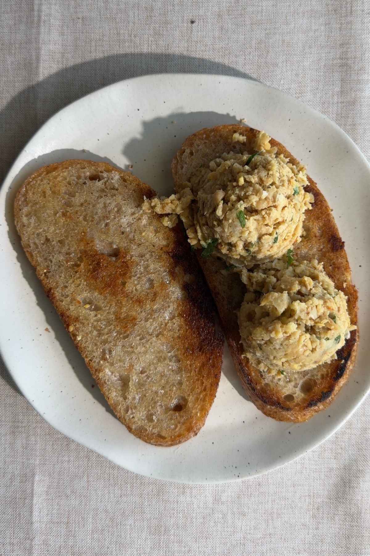Overhead shot of mashed chickpea sandwich.