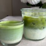 Hot and iced green lattes in glass cups.
