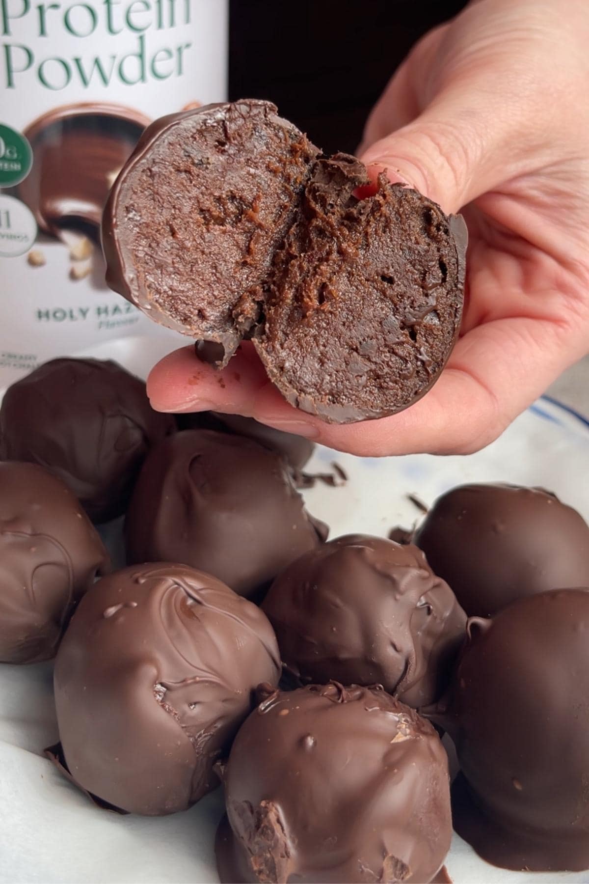 A halved chocolate ball showing its fudgy centre.
